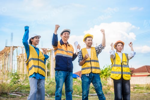Preview: An elderly male engineer,a middle-aged man,and two young Asian women unite hands construction site