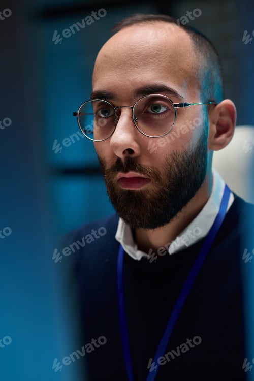 Preview: Closeup Man Looking at Screen in Blue Light