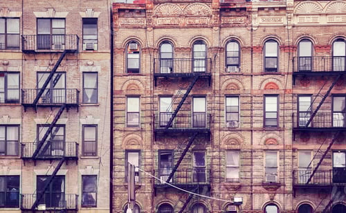 Old buildings with fire escapes in New York City.