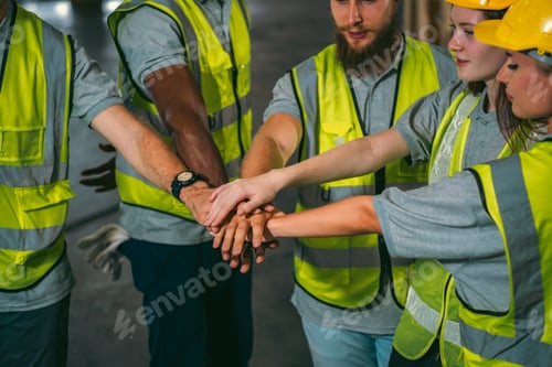 Preview: Group of various national engineer professional successful team corporate workers in factory
