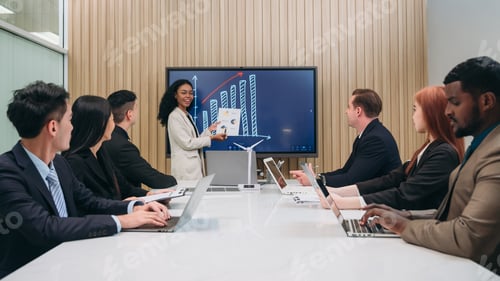 Preview: Businesspeople discussing during meeting in conference room. Clean Energy Discussions.