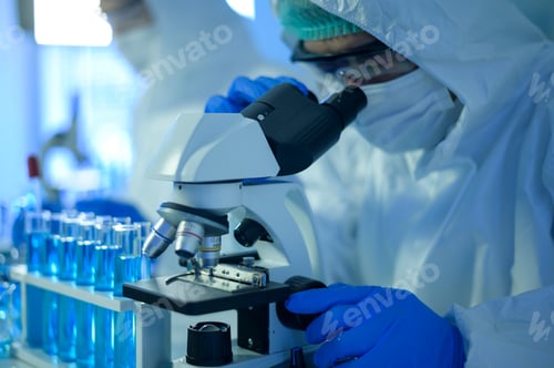 Preview: Scientist using microscope during experiment in laboratory