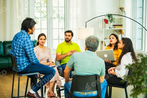 Preview: Diverse Indian startup team collaborating on mental health workplace wellness in a business meeting