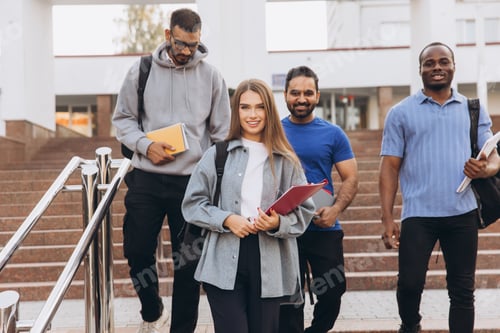 Preview: Diverse Group of Smiling College Students Walking on Campus Stairs with Backpacks and Books