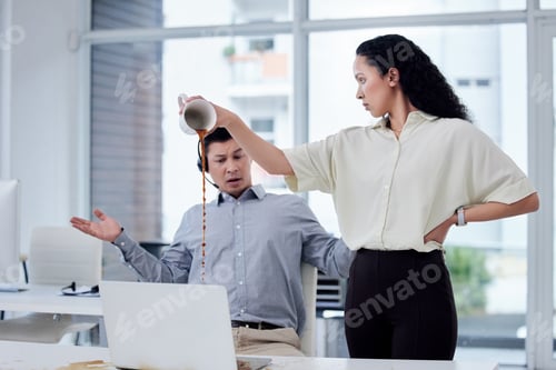 Preview: Shot of a businesswoman pouring a cup of coffee over a colleagues desk in a call centre