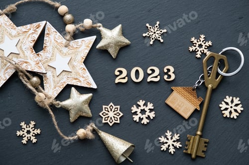 Preview: House key with keychain cottage on black background with stars,