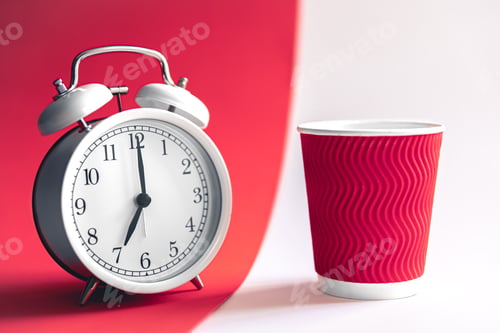 Preview: White stylish alarm clock and paper cup, morning concept.