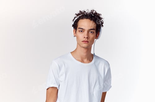 Preview: kinky guy with wired headphones listening to music new technology teenager model