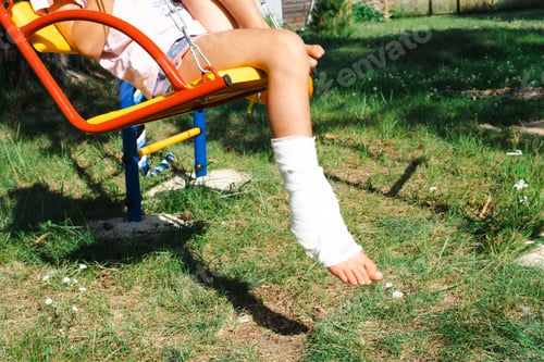 Preview: Children's legs are bandaged in plaster - barefoot on a swing