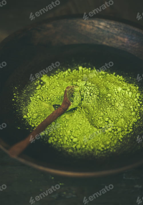 Preview: Japanese Matcha green tea powder in dark wooden bowl