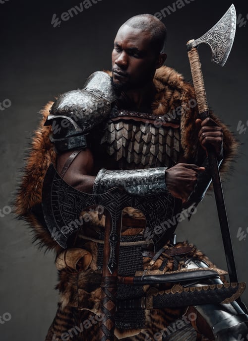 Preview: African guy dressed in military nordic costume holding an axe