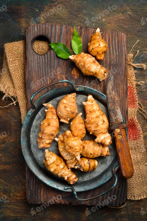Preview: Jerusalem Artichoke (Helianthus tuberosus) vegetable on wooden background.