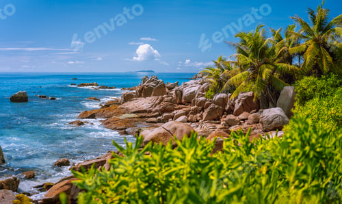 Preview: La Digue, Seychelles. Tropical exotic paradise like beach with granite boulders and coconut palm