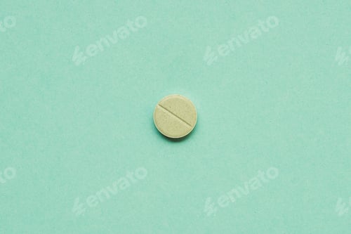 Preview: top view of round tablet on green background