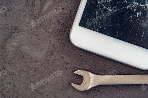 Preview: Smartphone repair concept. Damaged display of smartphone and tools