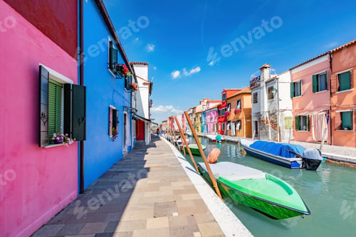 Preview: Burano, Italy with colorful painted houses along canal with boats