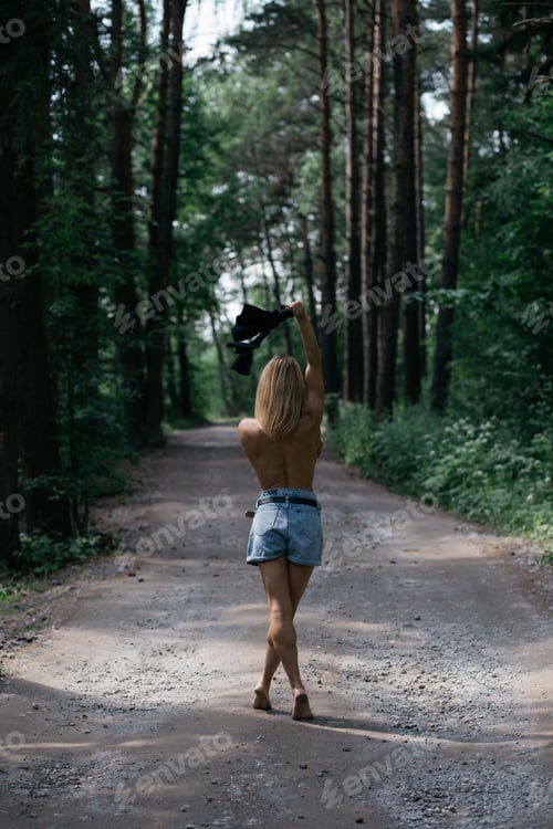 Preview: Woman Enjoying Nature and Fresh Air in Forest