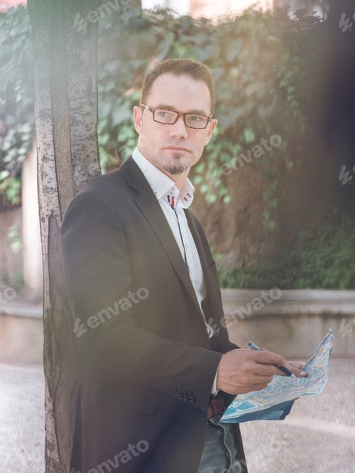 Preview: Businessman making notes on map