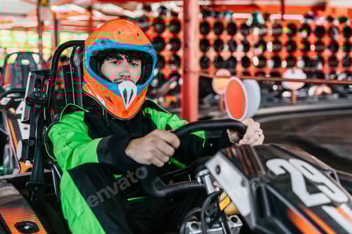 Preview: Young Man Driving Go-Kart with Orange Helmet