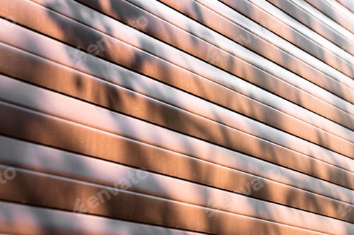 Preview: Abstract background, wall of brown material with geometric lines and plant shadow.