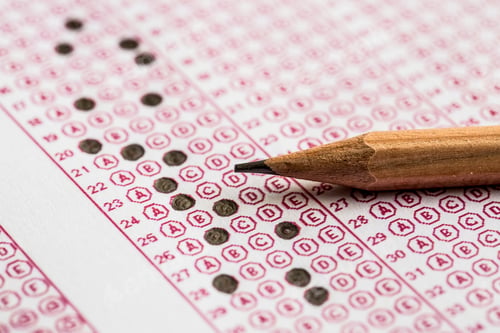 Preview: Exams quiz test paper with pencil drawing selected choice on answer sheets at school