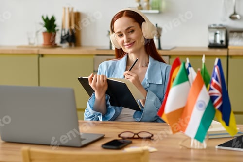 Preview: Online language teacher with vibrant red hair engaging students from home
