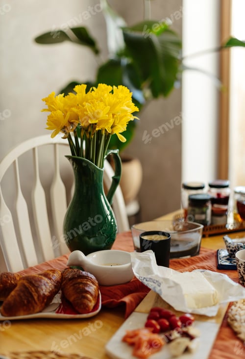 Preview: Person holding a cup of tea. A person pouring tea. Home breakfast style