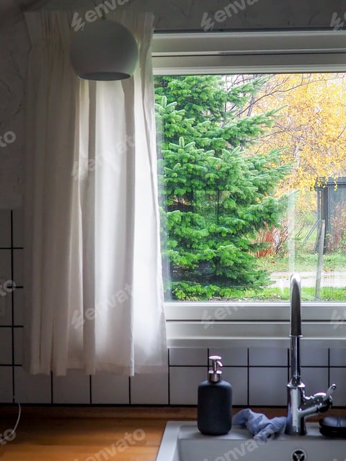 Preview: View from the kitchen window of a country house on an autumn day.