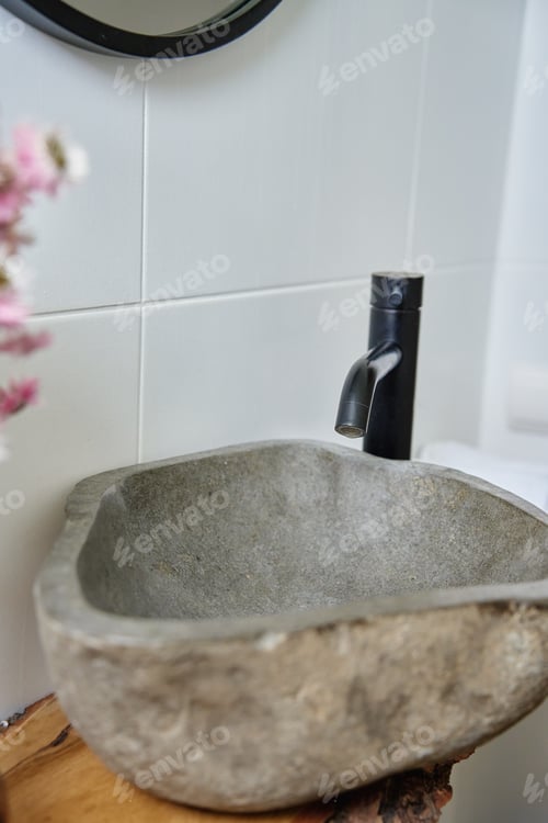 Preview: Rustic Stone Sink with Black Faucet and Bathroom Decor