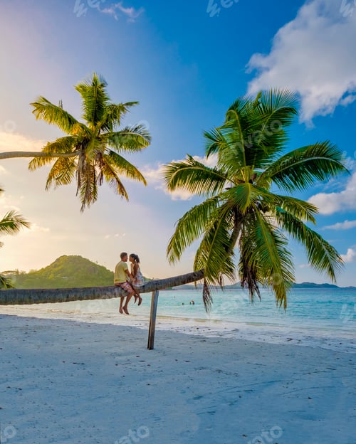 Preview: Praslin Seychelles tropical island with withe beaches and palm trees, couple men and woman in