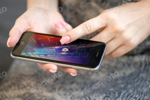 Preview: Mobile phone in female hands with screen showing compromised virus infected device. Data breach.