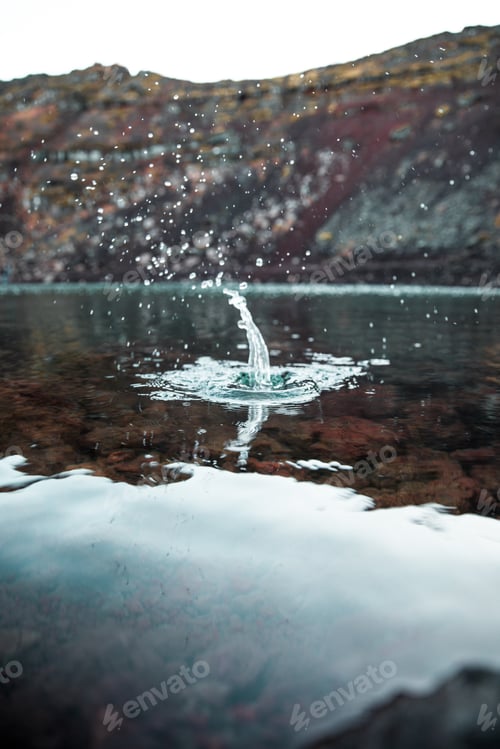 Preview: Vertical shot of water splash on a clear water