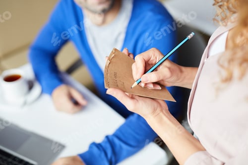 Preview: Making notes about customers order in cafe