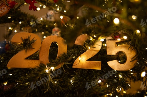 Preview: Horizontal Golden 2025 Ornament on Christmas Tree with Lights