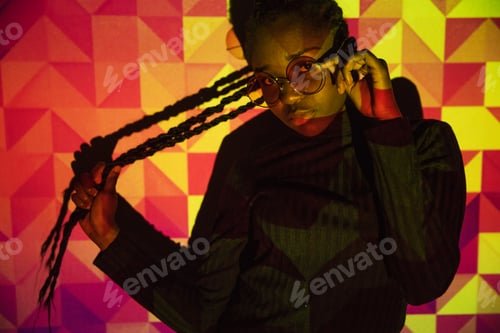 Preview: Creative colored pattern from projection light on beautiful women with dark skin