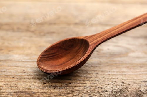 Preview: Clean new spoon on wooden background, closeup