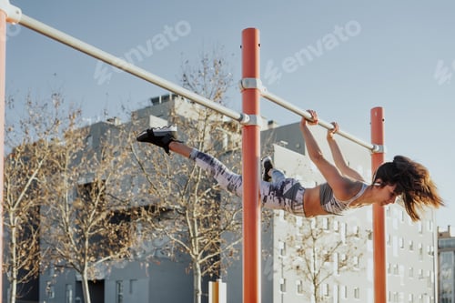 Preview: Woman training on parallel bars on street
