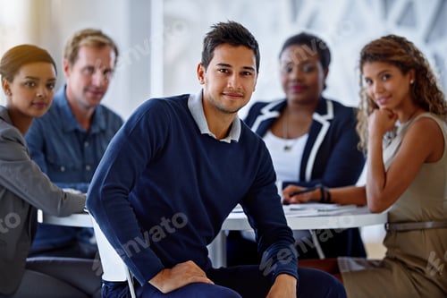 Preview: Portrait of a group of smiling colleagues sitting in an office