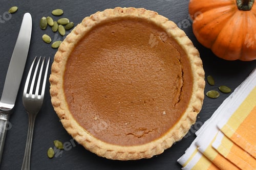 Preview: Delicious Pumpkin Pie with seeds and table setting