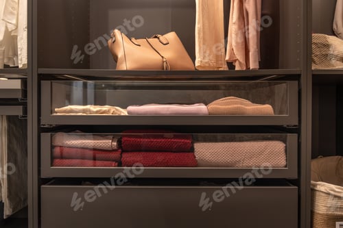 Preview: Modern wardrobe drawers with neatly folded clothes. Smart storage.