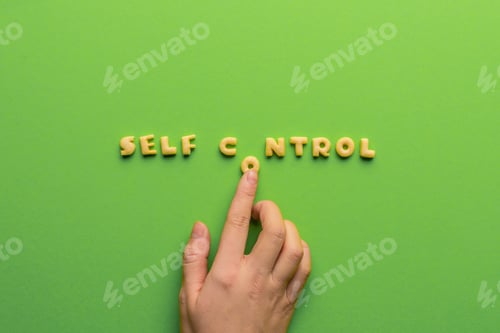 Preview: self controt concept, person making words of cookies isolated on green. healthy lifestyle and
