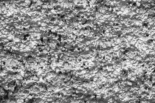 Preview: Bumpy Texture Of A Rough Shapeless Shining Surface Of A Wall Of Gray Color For Empty Abstract