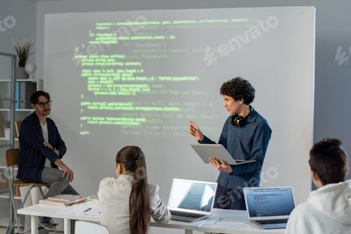 Preview: Clever student with laptop explaining main points of his presentation