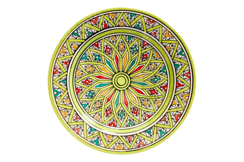 Preview: Old used green ceramic plate with traditional morrocan design isolated on white