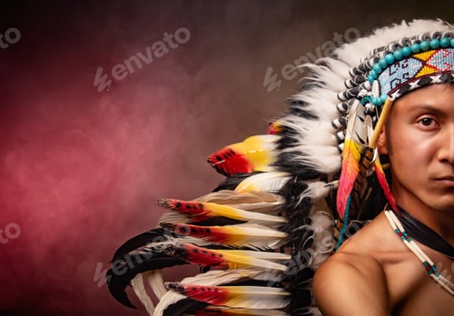 Preview: A man wearing a Native American headdress with feathers