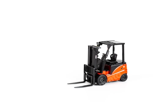 Preview: Miniature forklift toy on white background with copy space