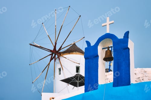 Preview: Old greek windmill on Santorini island in Oia town with stairs in street. Santorini, Greece