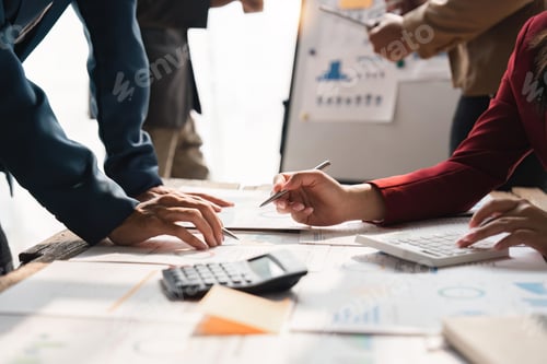 Preview: Business Team Analyzes Charts and Financials in Office