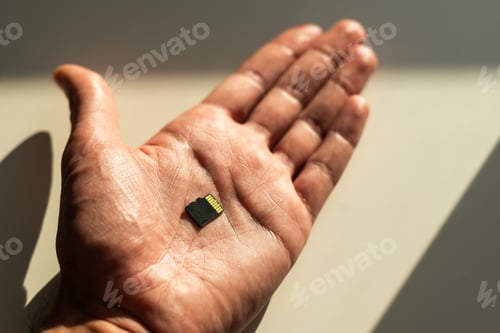 Preview: SD card Or memory card in hand concept of technology and in form of background.
