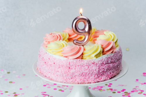 Preview: Celebration cake with pink frosting and a number nine candle for a birthday